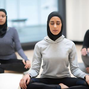 Live Better... Stay Fit... Connect with Local Women! 3 Muslim women doing yoga