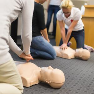 Image of Students doing CPR on Training aids.