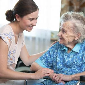 Do you want a job helping people meet their needs? Female Community Service worker with elderly woman