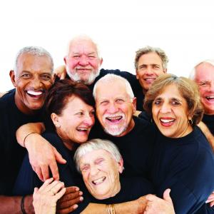 Laughter workshop for over 65s A group of seniors hugging and laughing
