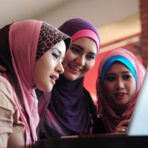 Classes are free and held during school hours 3 women learning English together