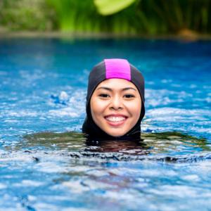 Muslim woman swimming