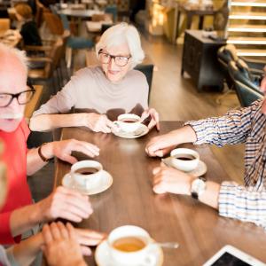 Join us for monthly Wednesday Information & Afternoon Tea sessions A group of senior men and women enjoying a chat over tea and coffee