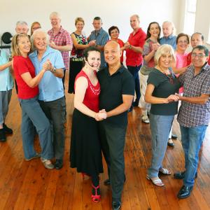 Group of Senior couples learning the salsa