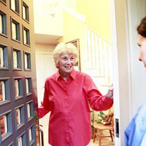 Carer visiting client at home