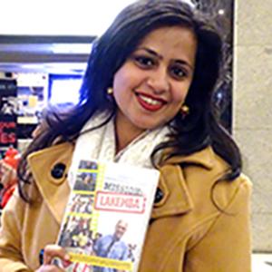 Picture of one of the movie stars holding a copy of the DVD